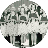 A small circular photo of three Gretna, Nebraska girls in an old-fashioned dance recital.