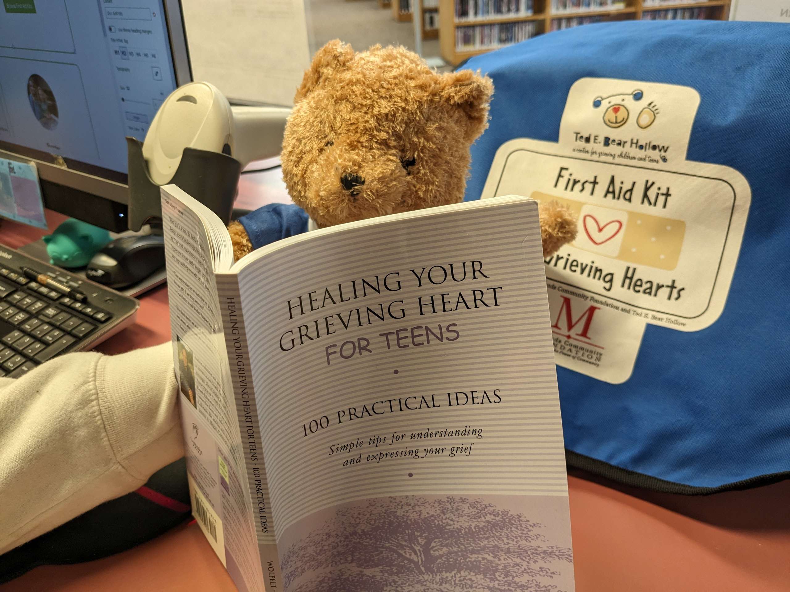 Image of a teddy bear made to look like it is reading a book called "Healing Your Grieving Heart for Teens".